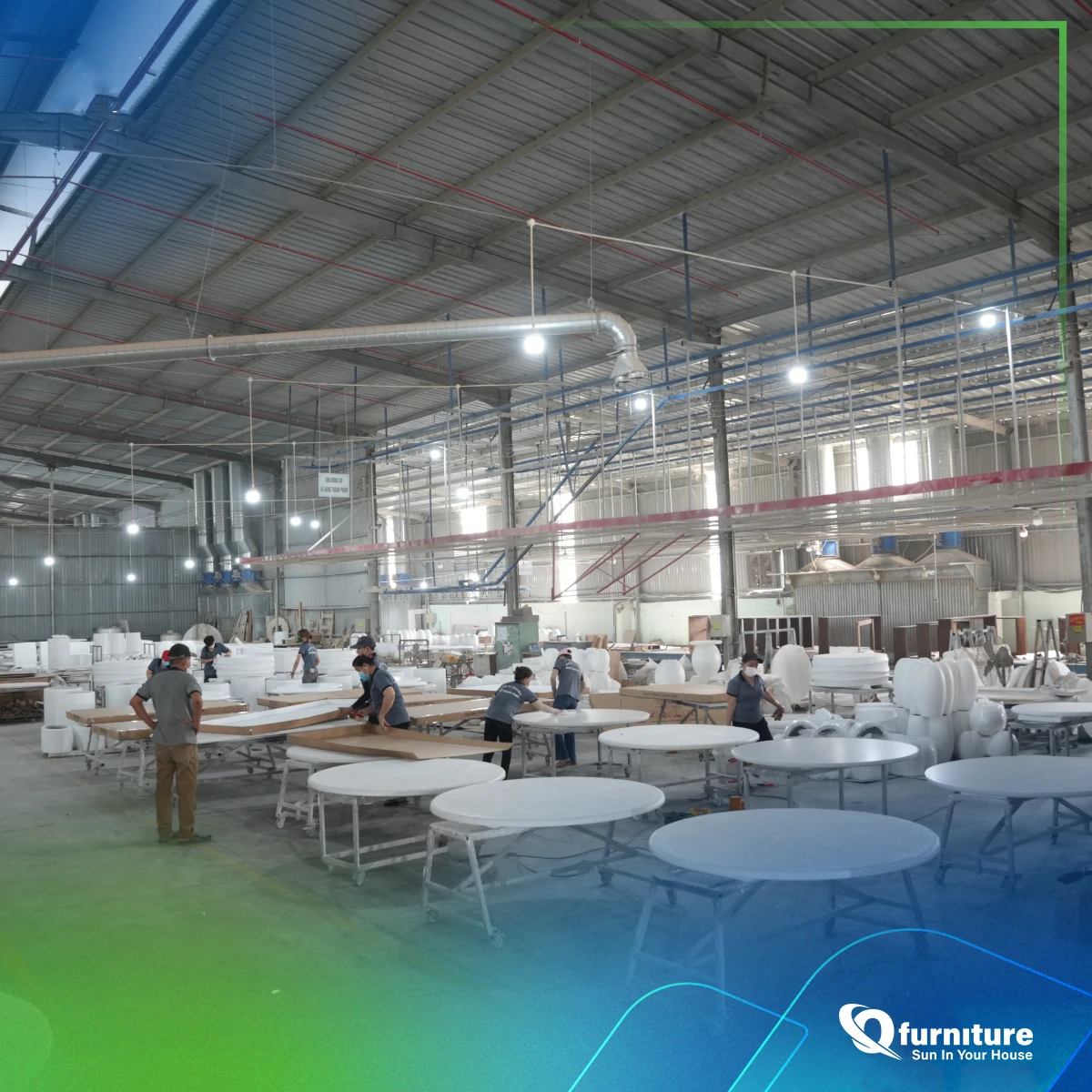 Wide view of the Q-Furniture production hall with concrete tables being finished