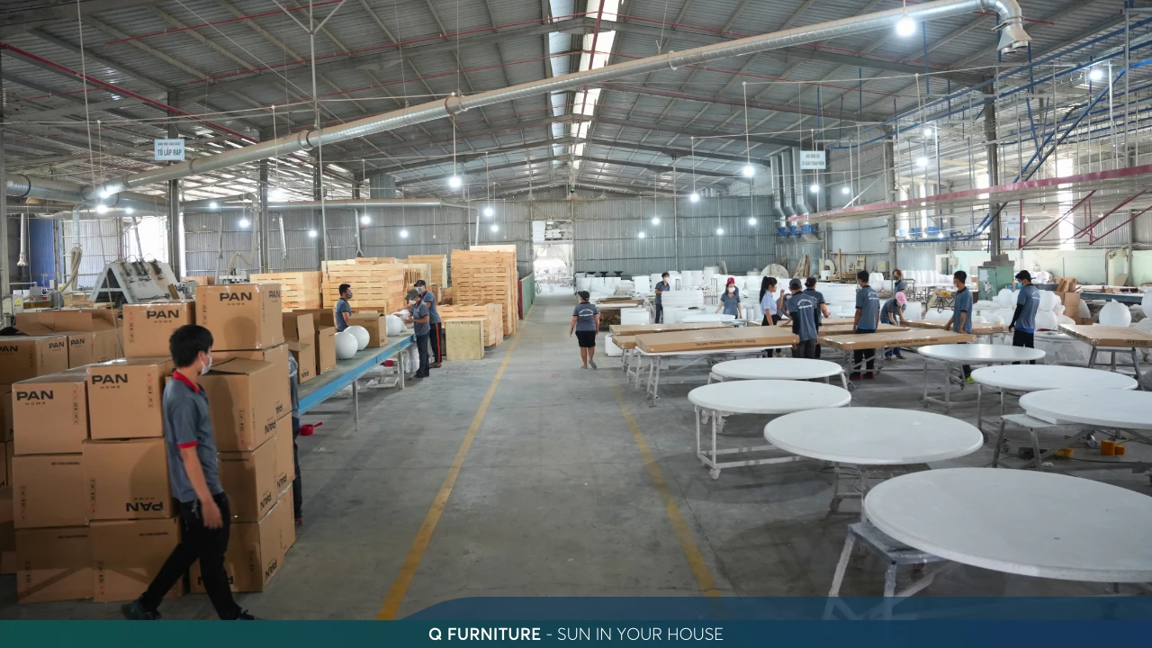 Finished concrete tables and crates in the Q-Furniture warehouse before container loading