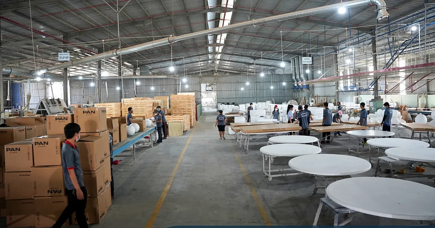 Export warehouse with packed cartons and finished concrete table tops